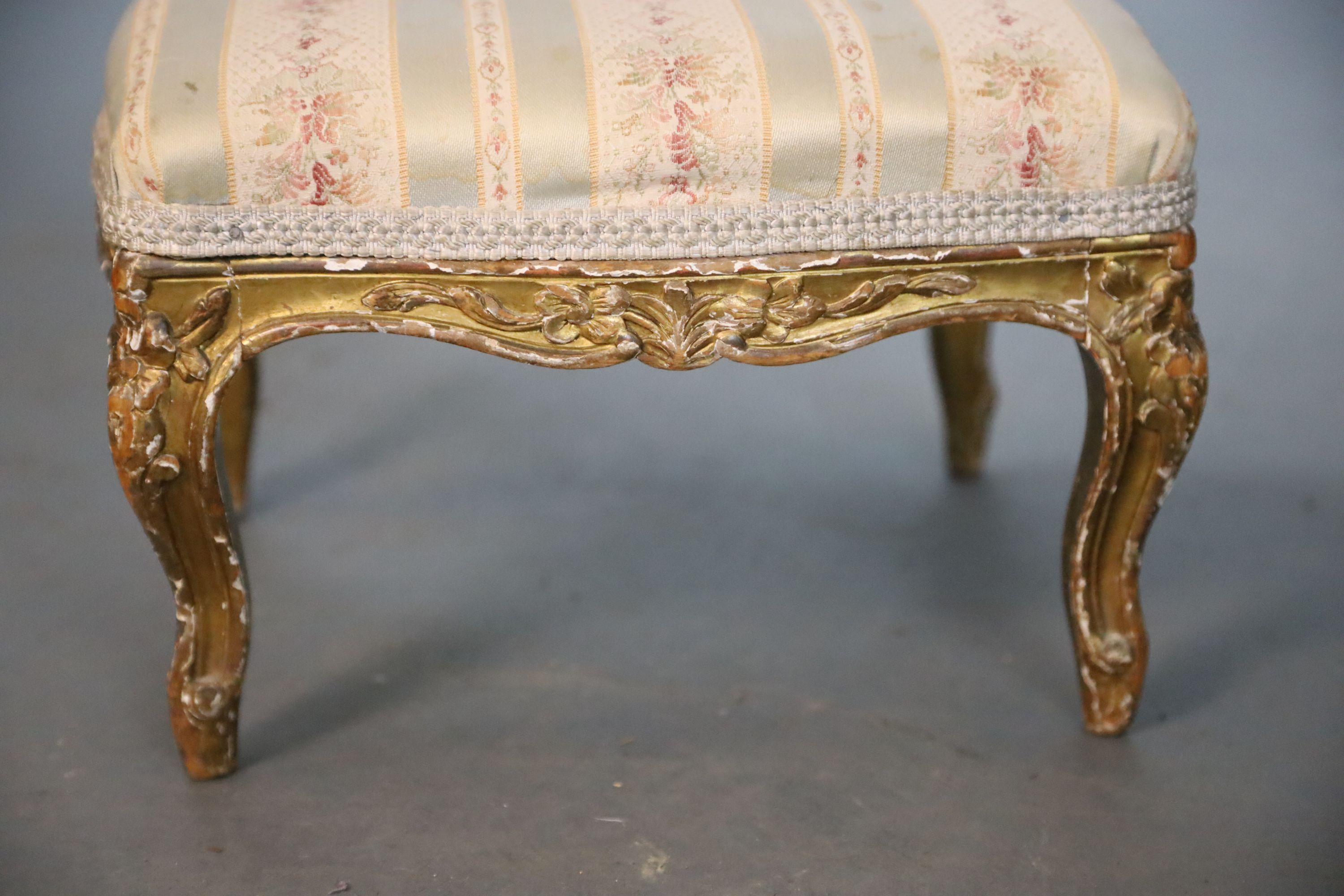 A Louis XVI style giltwood foot stool and a similar beech foot stool